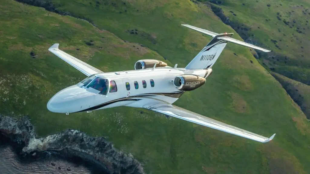 Citation M2 Gen2 flying over coastal land