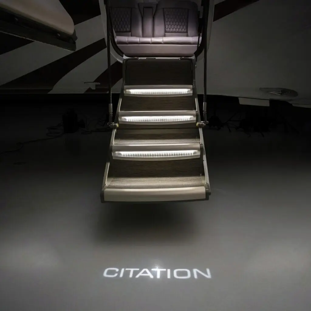 Luxurious jet entrance steps with illuminated Citation logo